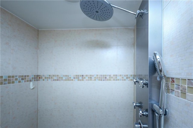 full bathroom with a tile shower