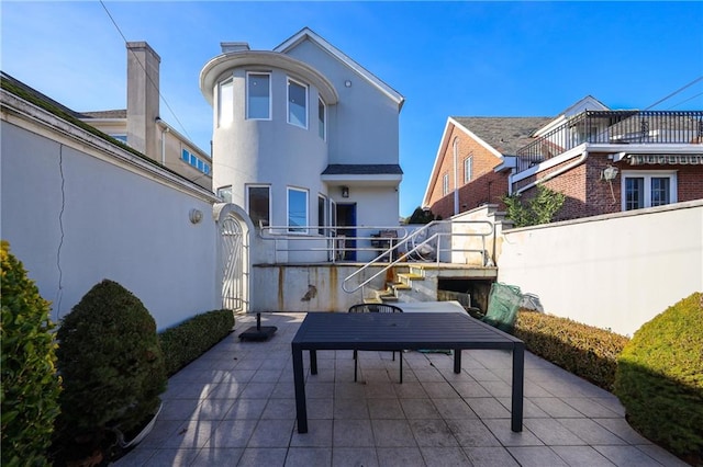 view of patio / terrace featuring fence