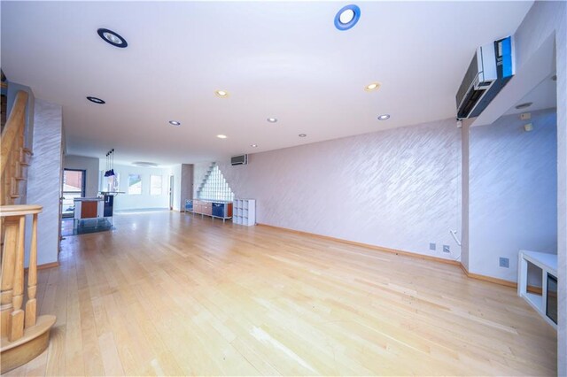 unfurnished living room featuring light hardwood / wood-style floors