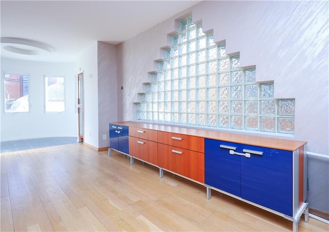 interior space with light wood-style floors and baseboards