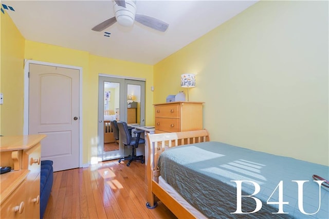 bedroom featuring hardwood / wood-style floors, ceiling fan, and a closet