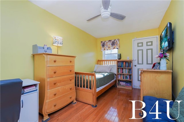 bedroom featuring hardwood / wood-style flooring and ceiling fan