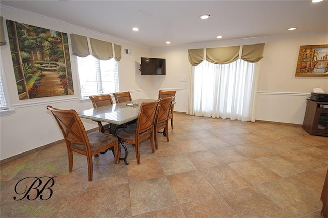 dining area with ornamental molding, recessed lighting, and baseboards