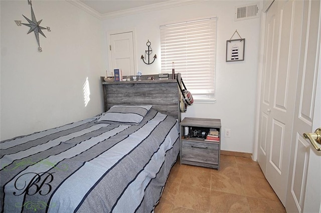 bedroom with tile patterned floors, baseboards, visible vents, and ornamental molding