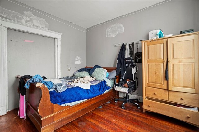 bedroom featuring dark wood-type flooring