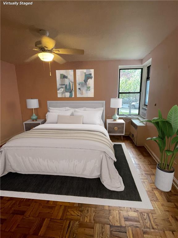 bedroom with parquet floors and ceiling fan