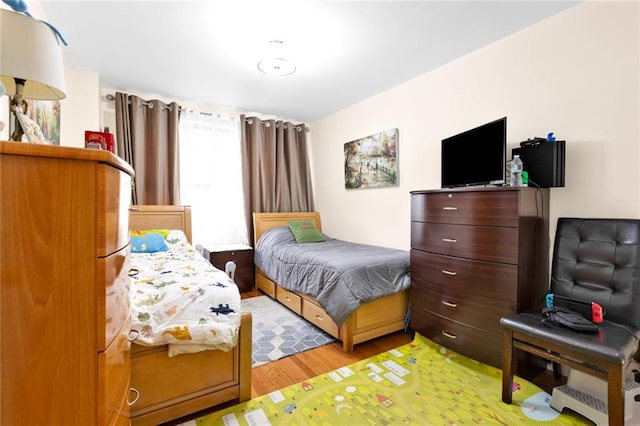 bedroom featuring light wood-type flooring