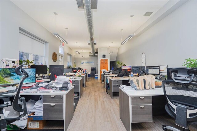 office area with light hardwood / wood-style floors