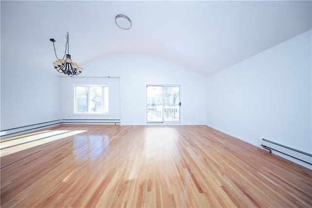 unfurnished living room featuring lofted ceiling, a chandelier, light wood-type flooring, and baseboard heating