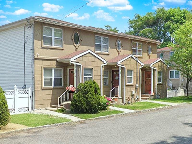 273-B Jewett Ave, Staten Island, NY 10302 - view of property featuring fence, entry steps, and stucco siding