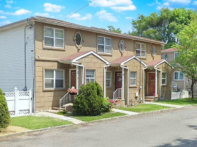 273-B Jewett Ave, Staten Island, NY 10302 - view of property featuring fence, entry steps, and stucco siding