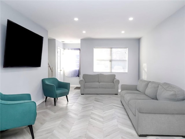 living room with recessed lighting and baseboards