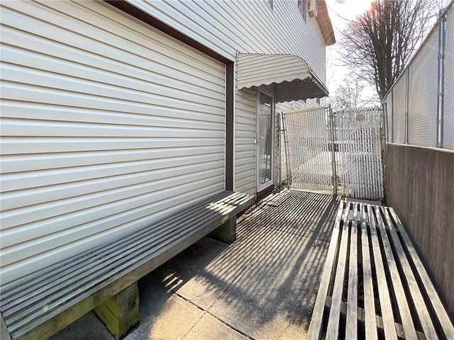 view of patio / terrace with fence and a gate