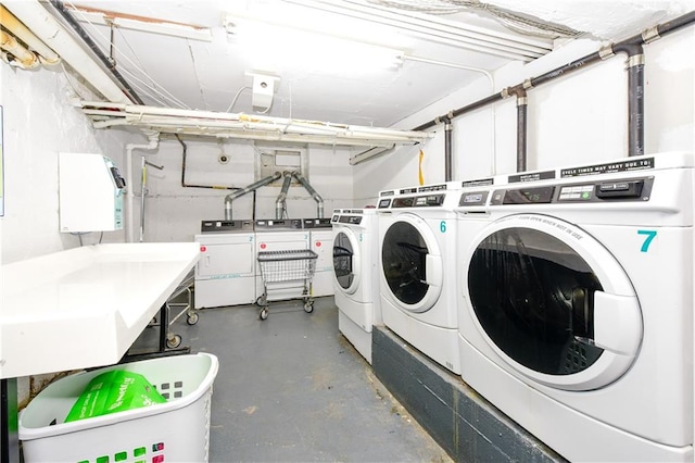 laundry area with independent washer and dryer