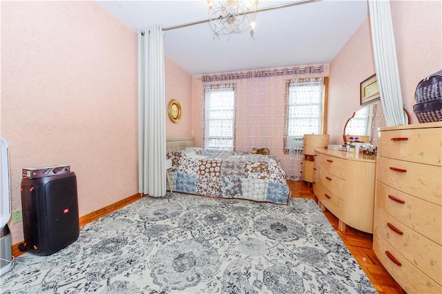 bedroom featuring an inviting chandelier