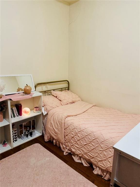 bedroom featuring wood finished floors