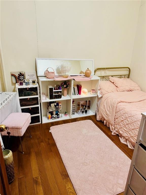 bedroom featuring wood finished floors