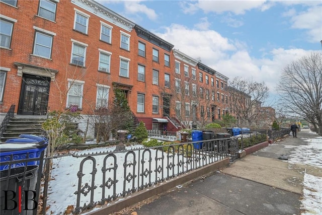 view of property featuring a fenced front yard