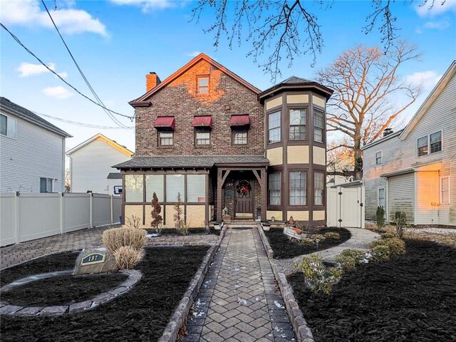 rear view of house featuring a yard