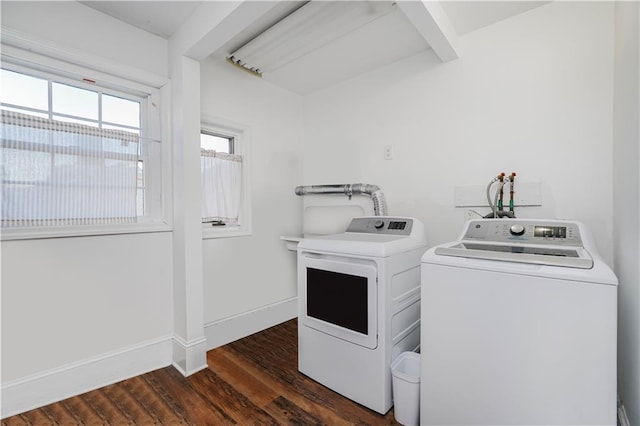 washroom featuring baseboards, dark wood-style flooring, and washer and clothes dryer