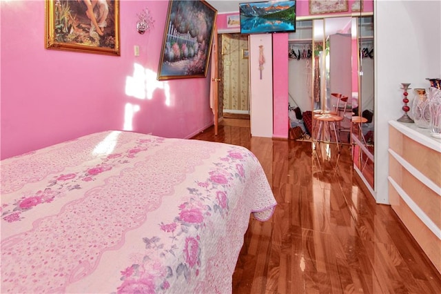 bedroom featuring wood finished floors