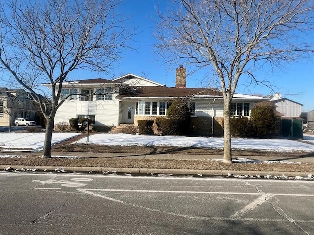 tri-level home with a chimney