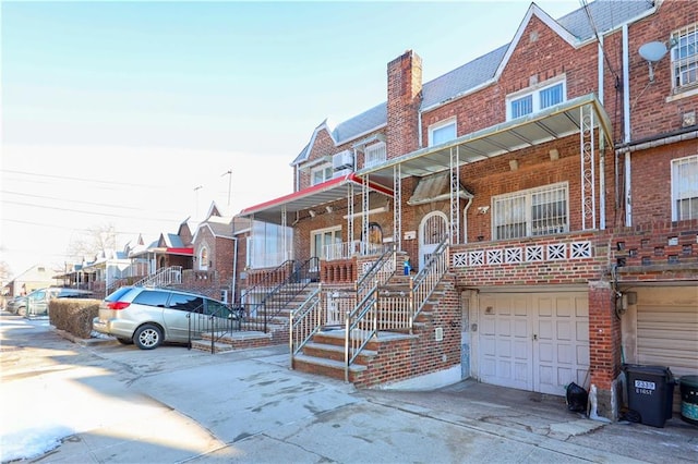 multi unit property featuring a garage