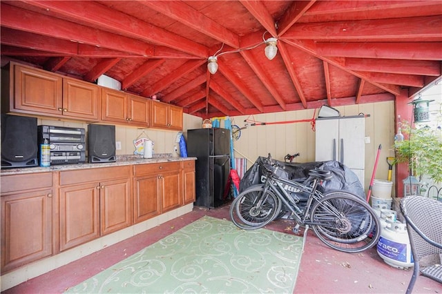 garage featuring black refrigerator