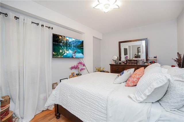 bedroom with light wood finished floors