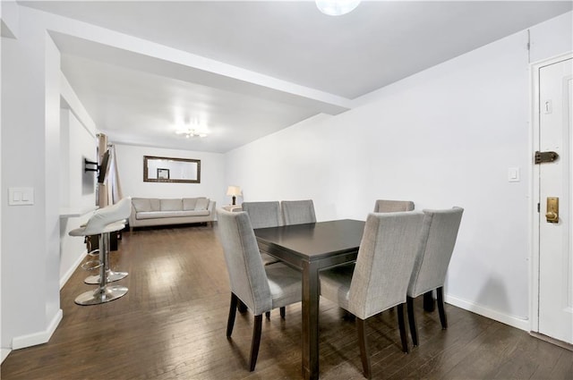 dining room featuring dark wood-type flooring