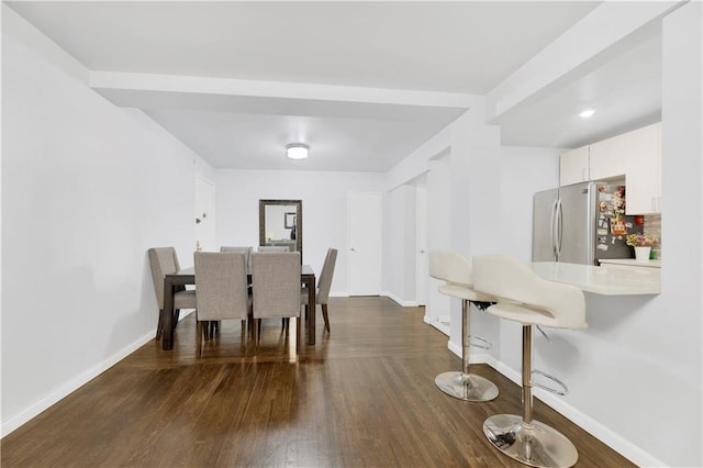 dining space featuring dark hardwood / wood-style flooring