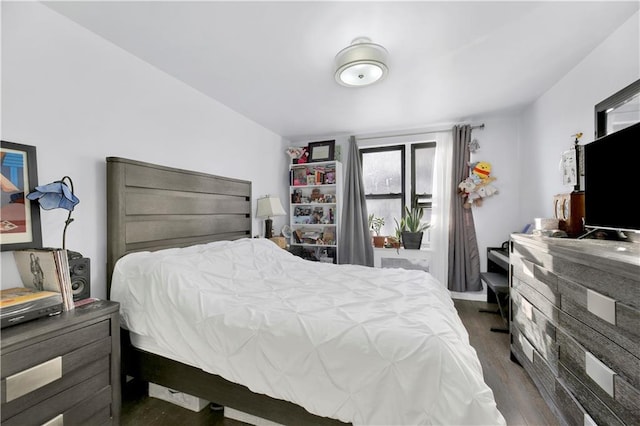 bedroom featuring dark wood-type flooring