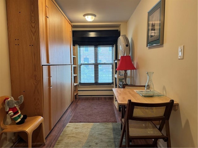 kitchen with a baseboard radiator and dark wood-style flooring