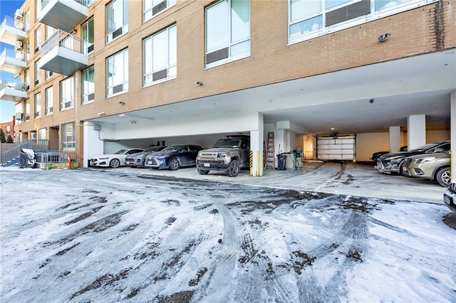 view of snow covered parking