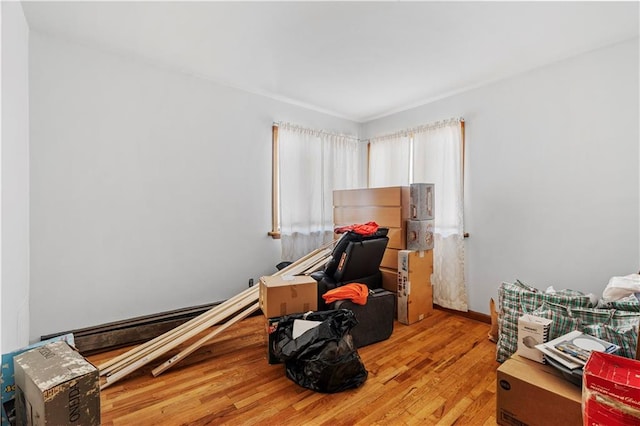 interior space featuring a baseboard radiator and light hardwood / wood-style flooring