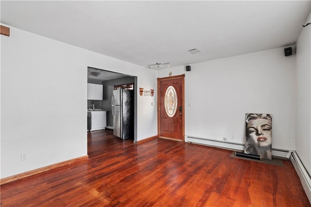 foyer entrance featuring dark hardwood / wood-style floors