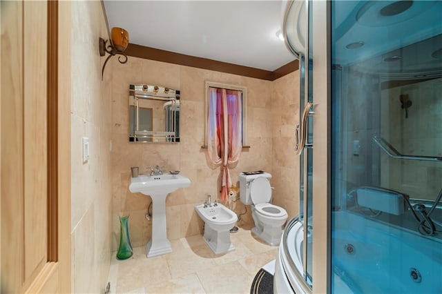 bathroom with walk in shower, tile patterned floors, toilet, tile walls, and a bidet