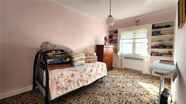 bedroom featuring crown molding, radiator heating unit, and baseboards