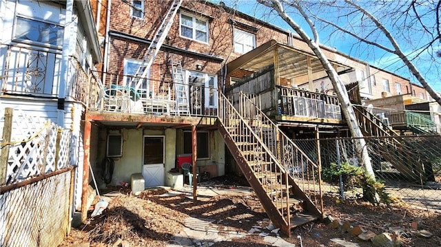 4400 Bedford Ave, Brooklyn, NY 11229 - back of house with brick siding, a wooden deck, and stairs