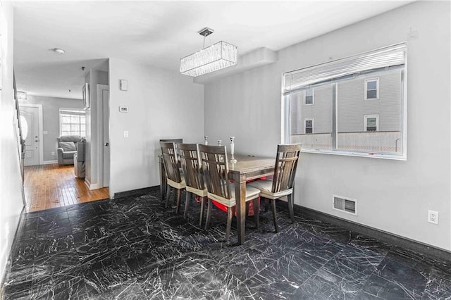 dining room with an inviting chandelier