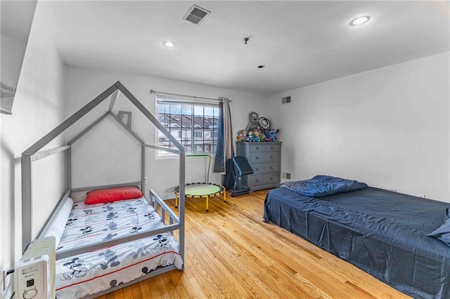 bedroom featuring wood-type flooring