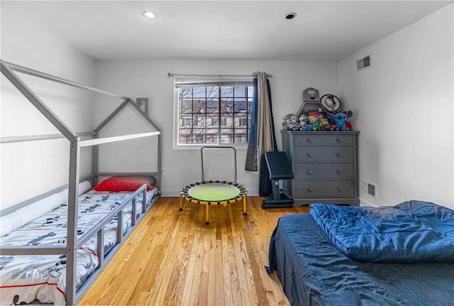 bedroom featuring hardwood / wood-style floors