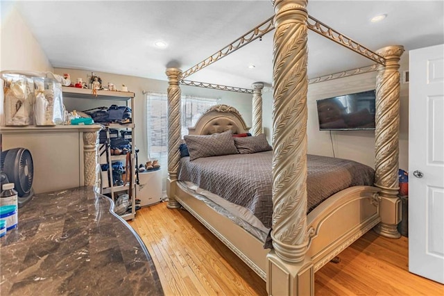 bedroom with hardwood / wood-style flooring