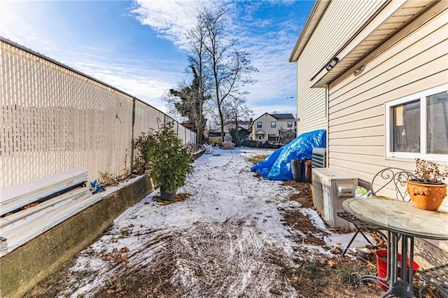 view of yard layered in snow