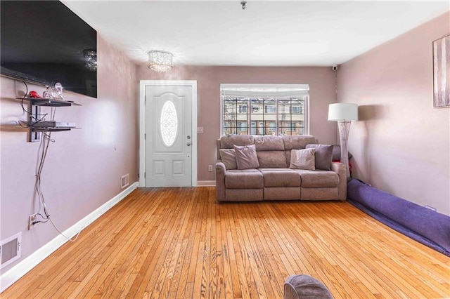 unfurnished living room featuring light wood-type flooring