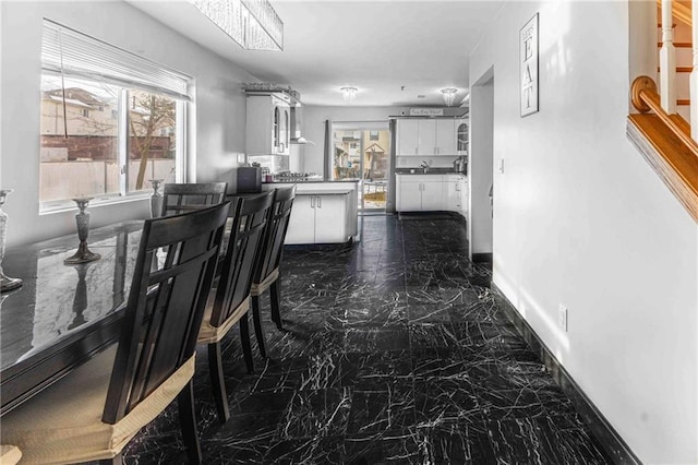 dining area featuring a healthy amount of sunlight