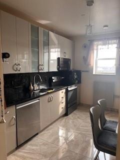 kitchen with sink and black appliances