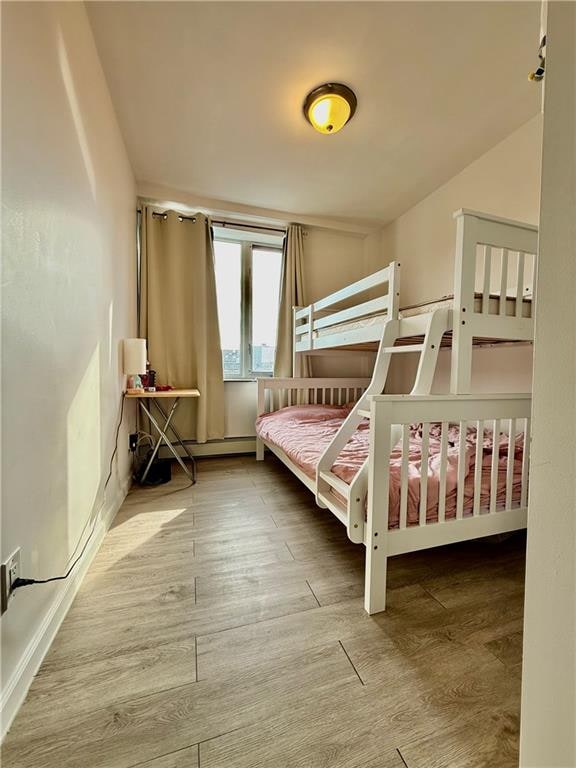 bedroom with wood finished floors