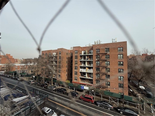 view of building exterior featuring a view of city