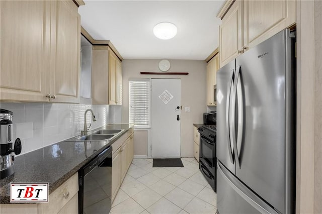 kitchen with black appliances, tasteful backsplash, light brown cabinets, and a sink